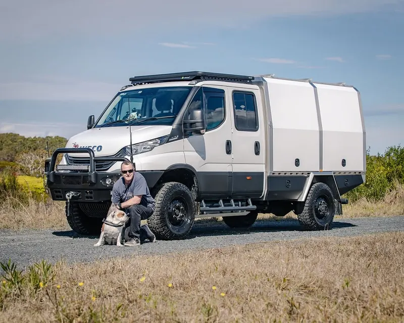 White Iveco 4WD with custom service body transformation featuring storage compartments